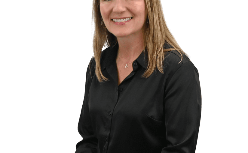 Sarah Zimmerman, Superintendent at Sandusky County Board of Developmental Disabilities, smiling in professional black shirt against white background